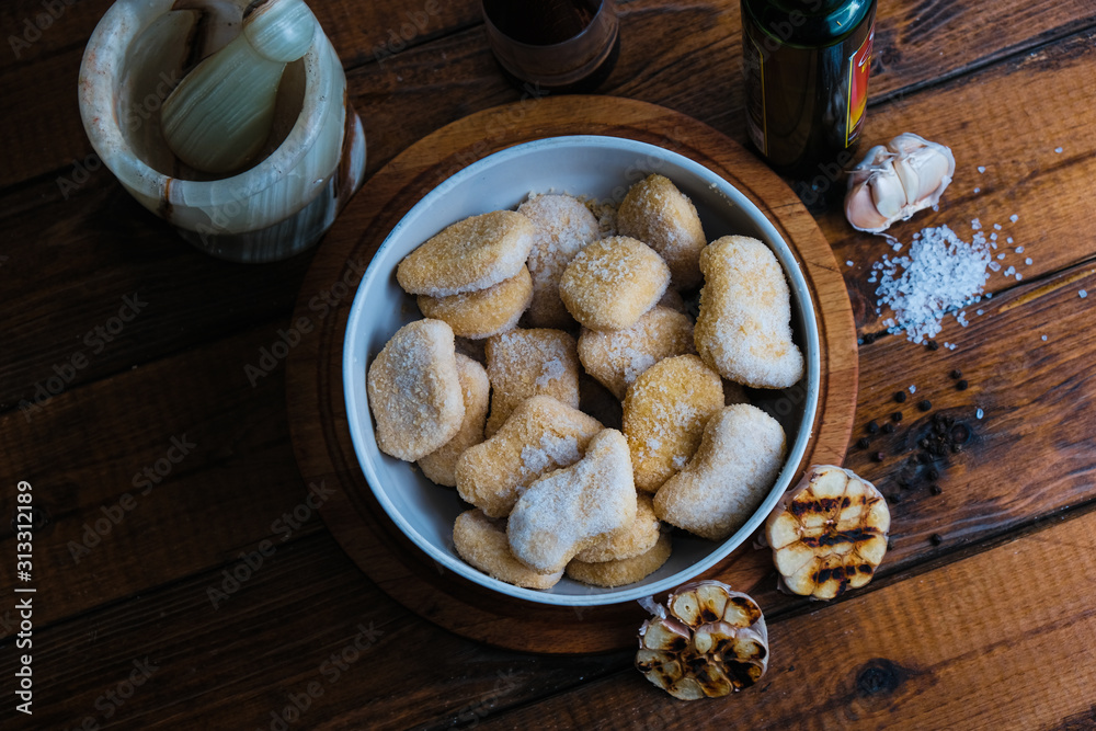 chicken nuggets composition on a wooden background chicken nuggets composition on a wooden background
