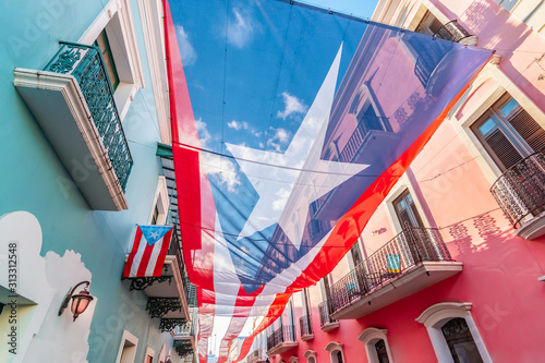 Large flag of Puerto Rico above the street in the city center of San Juan. photo