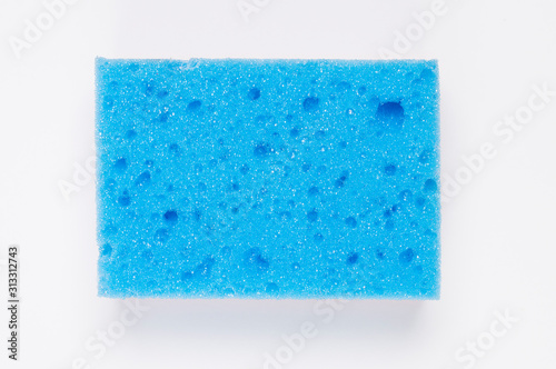 blue sponge for washing on a white background photo