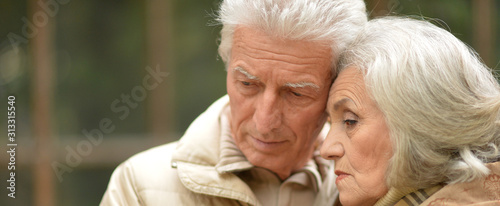 Close up portrait of sad thoughtful senior couple