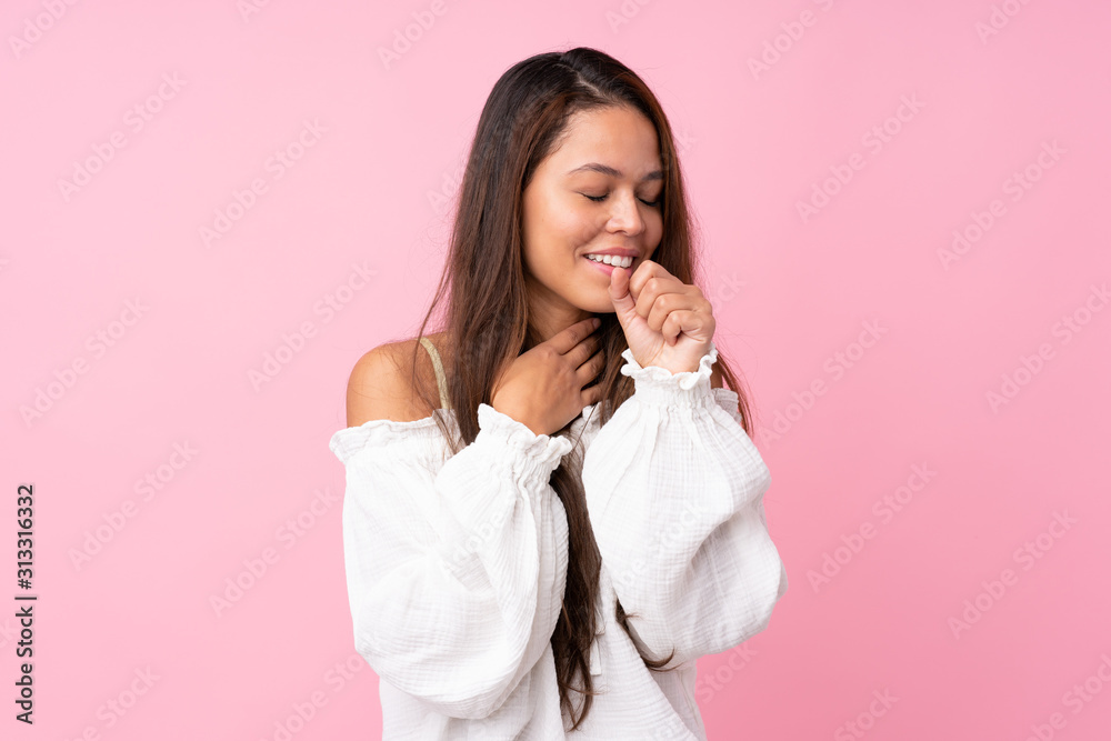 Young Brazilian girl over isolated pink background is suffering with cough and feeling bad Young Brazilian girl over isolated pink background is suffering with cough and feeling bad