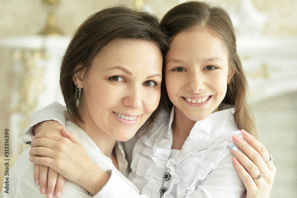 Beautiful young mother and cute little daughter posing Beautiful young mother and cute little daughter posing