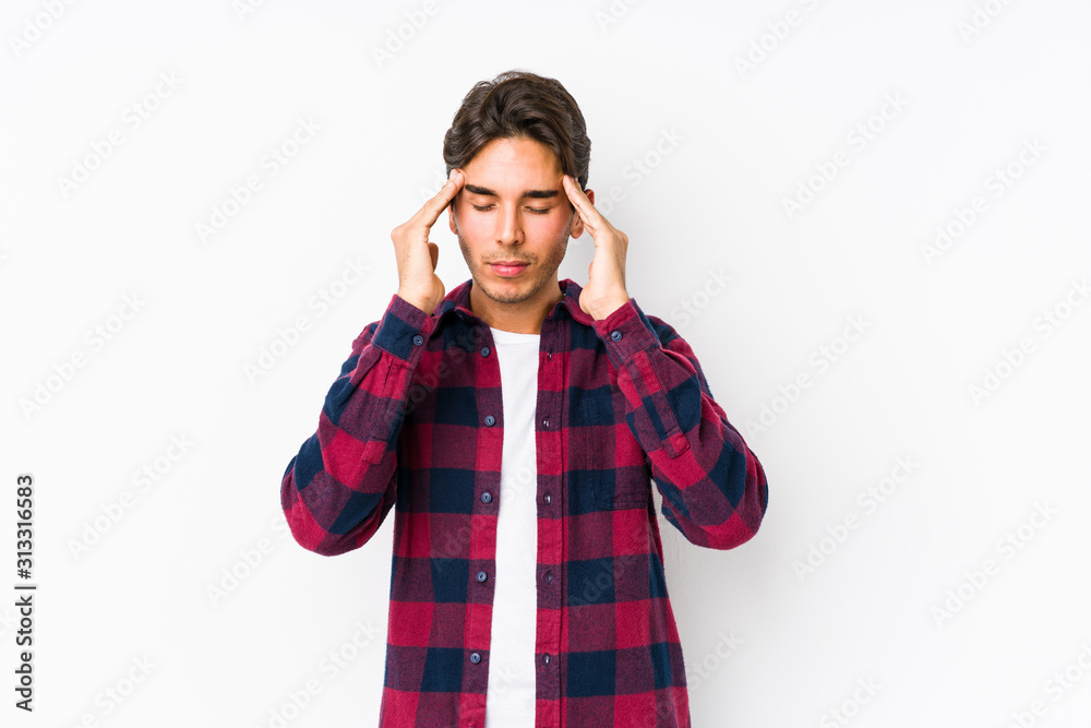 Young caucasian man posing in a pink background isolated touching temples and having headache. Young caucasian man posing in a pink background isolated touching temples and having headache.