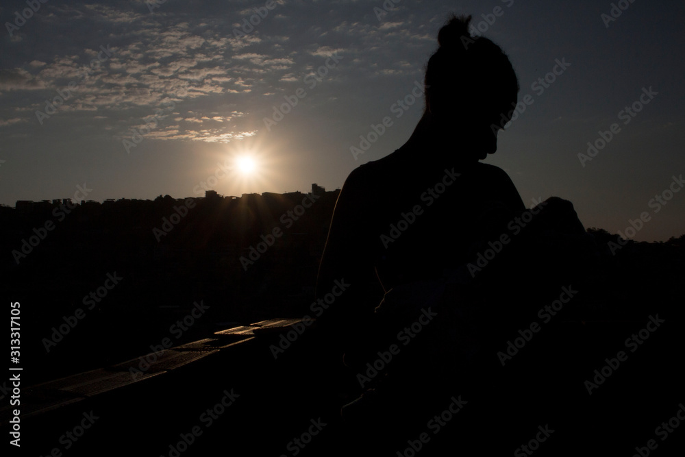 silhouette of a woman with baby