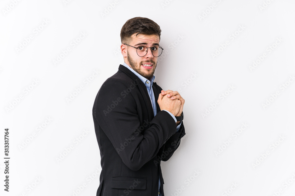 Young caucasian business man posing in a white background isolated Young caucasian business man scared and afraid. Young caucasian business man posing in a white background isolated Young caucasian business man scared and afraid.
