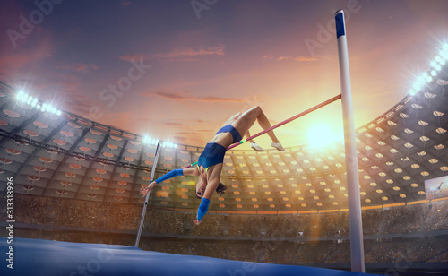 Fototapeta Naklejka Na Ścianę i Meble -  Athlete woman doing a high jump on sport championship.