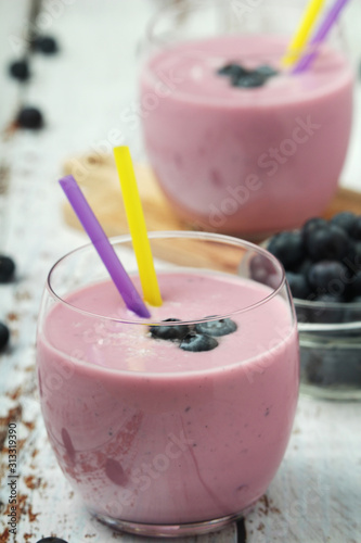 Two glasses with blueberry yogurt	