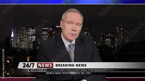 MS Senior male presenting breaking news live from television studio