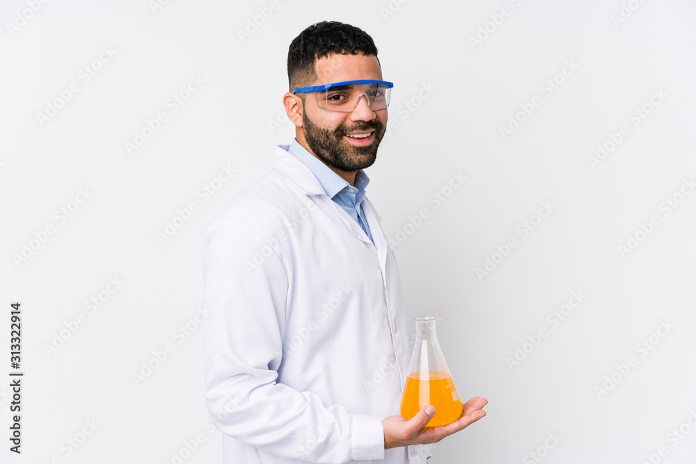 Young arabian chemical man isolated looks aside smiling, cheerful and pleasant. Young arabian chemical man isolated looks aside smiling, cheerful and pleasant.