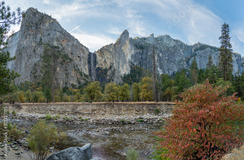 View of Yosemite Waterfall On Large Peak With Stream in the Foreground During Fall Season