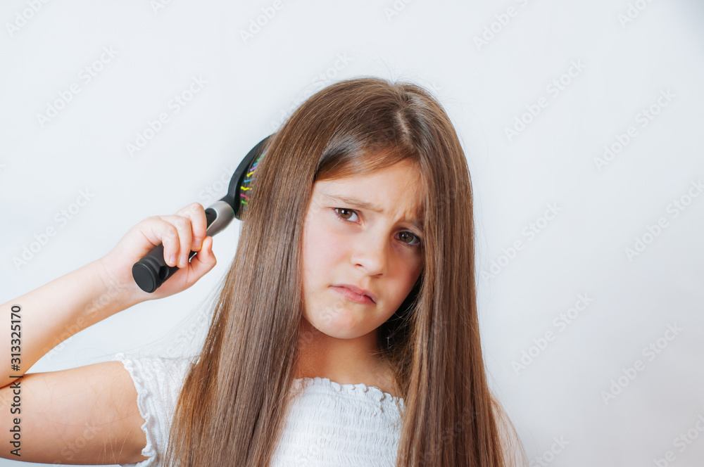 Fototapeta premium Caucasian little cute girl unhappy with very long hair, portrait