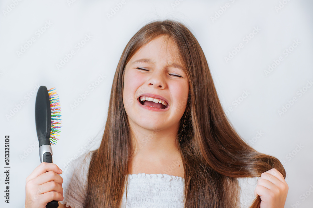 Caucasian little cute girl unhappy with very long hair, portrait Caucasian little cute girl unhappy with very long hair, portrait