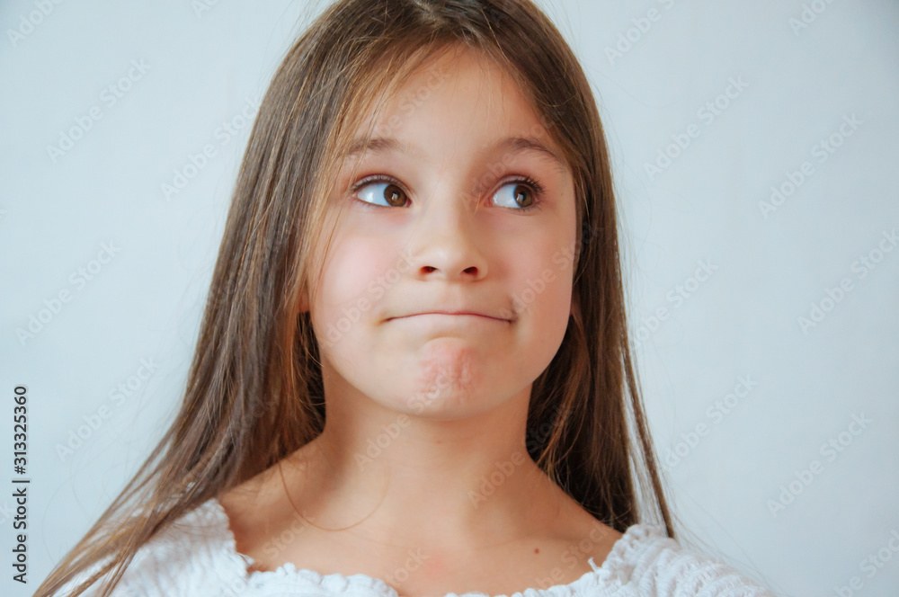 Caucasian little cute girl unhappy with very long hair, portrait Caucasian little cute girl unhappy with very long hair, portrait