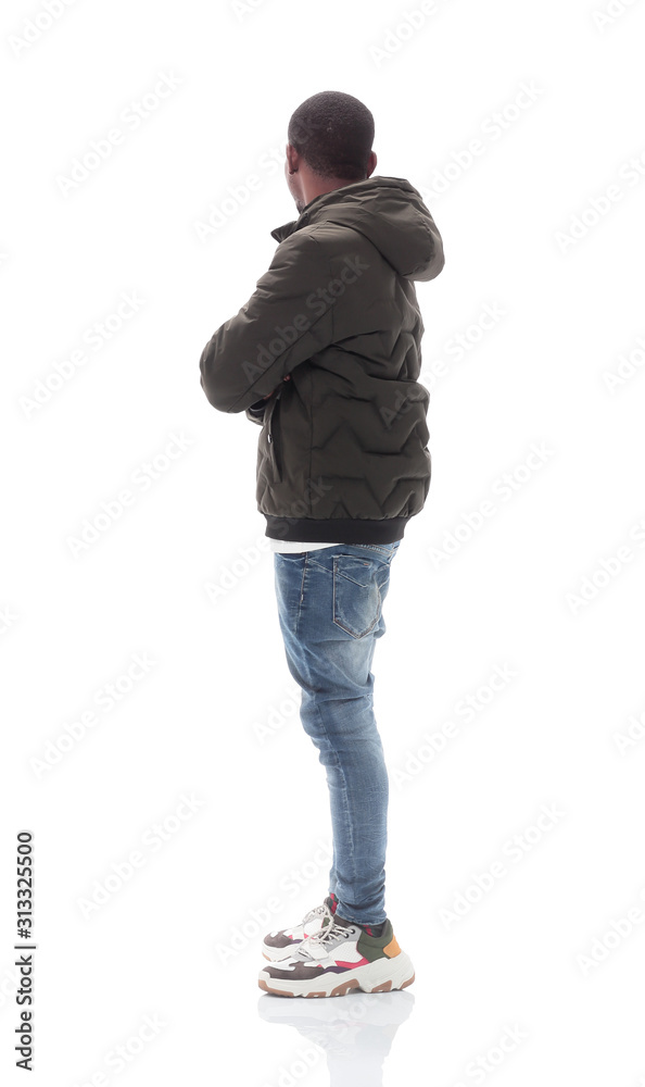 Fototapeta premium side view. casual guy in jeans looking at copy space