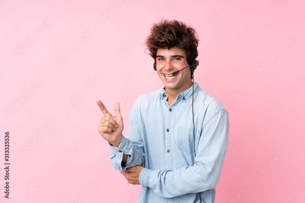 Young caucasian man over isolated pink background pointing side Young caucasian man over isolated pink background pointing side
