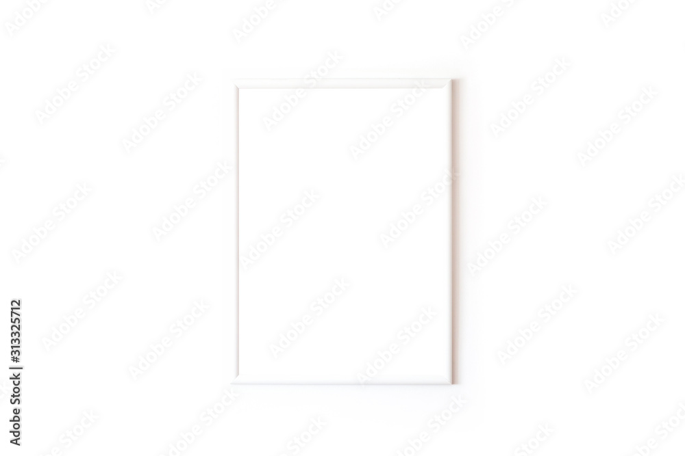 Blank white square frame in front of white wall Blank white square frame in front of white wall