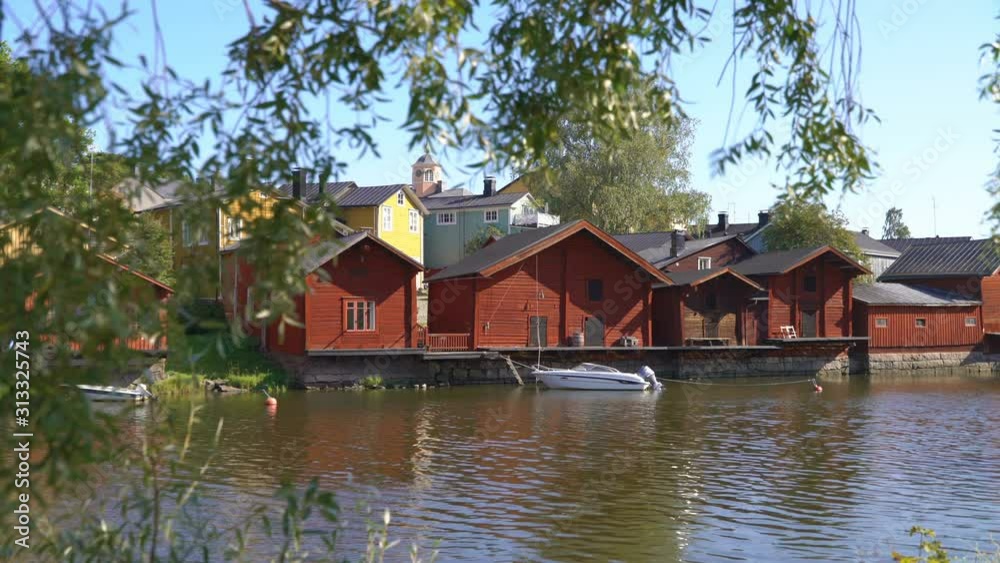 Old town of Porvoo, Finland. Idyllic city landscape with old wooden red houses at the riverside. Porvoo is One of the UNESCO world heritage sites in Finland Old town of Porvoo, Finland. Idyllic city landscape with old wooden red houses at the riverside. Porvoo is One of the UNESCO world heritage sites in Finland