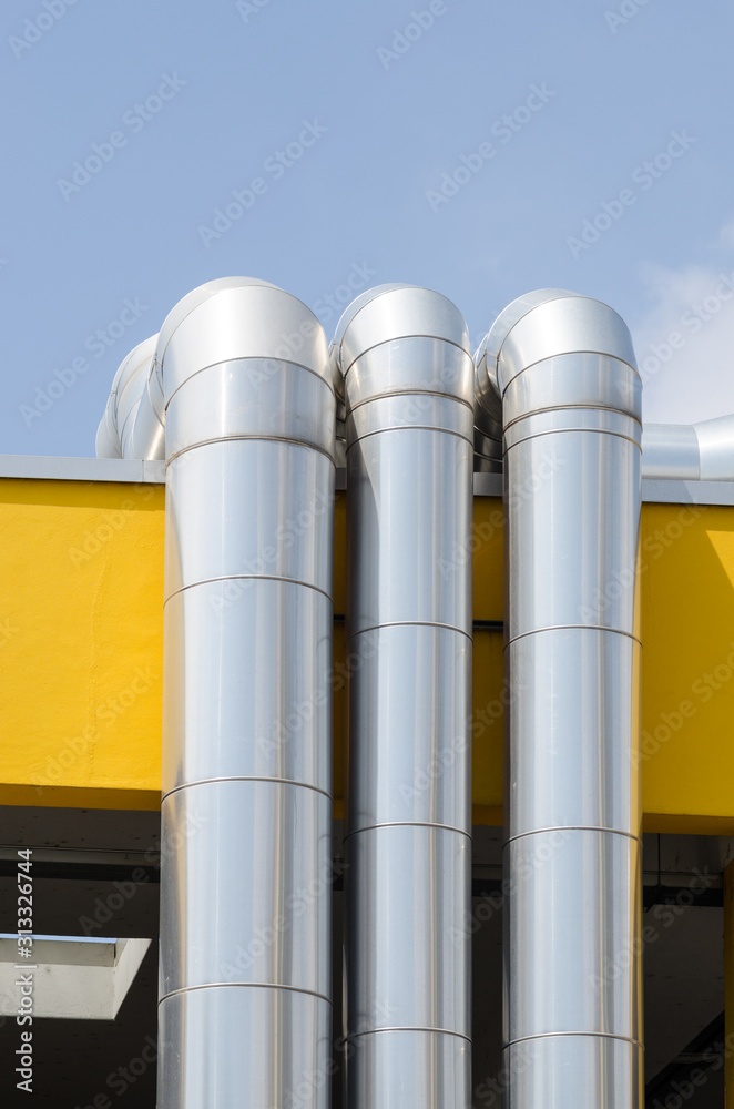 Ventilation, pipes of the service system on a roof, in galvanized steel. pipes in the air circulation system or ventilation system fumes Ventilation, pipes of the service system on a roof, in galvanized steel. pipes in the air circulation system or ventilation system fumes