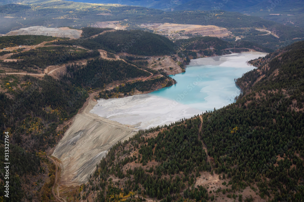 Aerial view of Copper Mine Tailing pond in the interior British Columbia, Canada. Taken during a fall season morning.