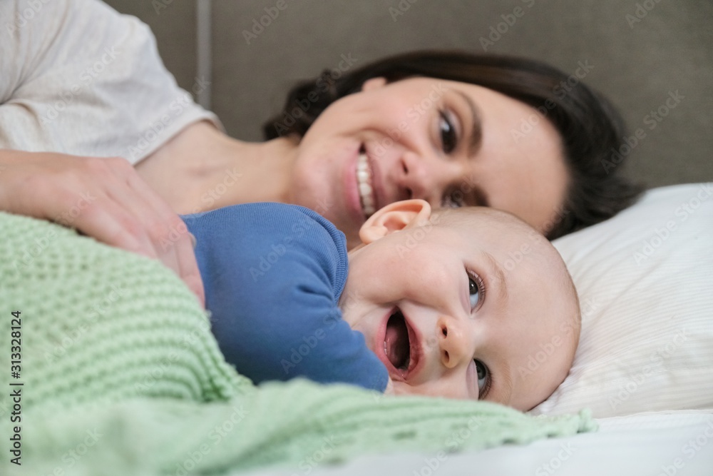 Portrait of beautiful young mother and her baby 7 month old son Portrait of beautiful young mother and her baby 7 month old son