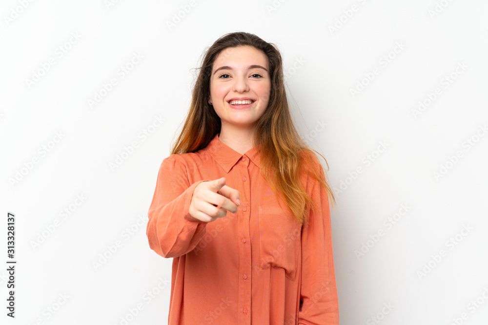 Young brunette girl over isolated white background surprised and pointing front Young brunette girl over isolated white background surprised and pointing front