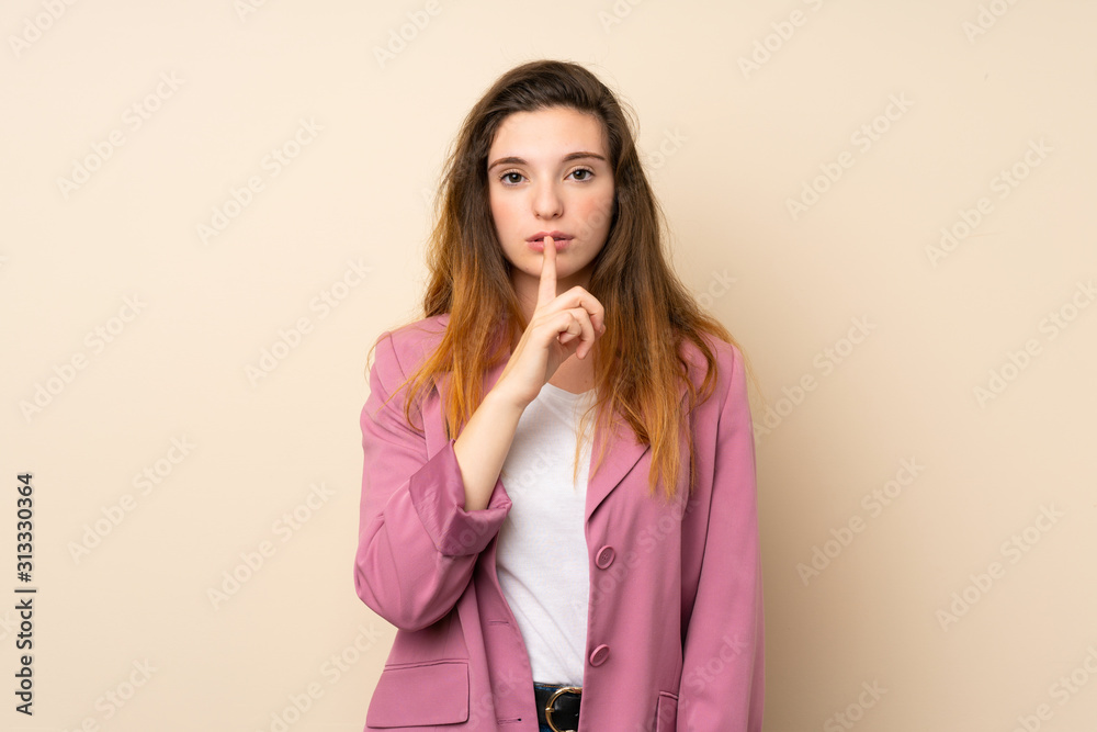 Young brunette girl with blazer over isolated background showing a sign of silence gesture putting finger in mouth Young brunette girl with blazer over isolated background showing a sign of silence gesture putting finger in mouth