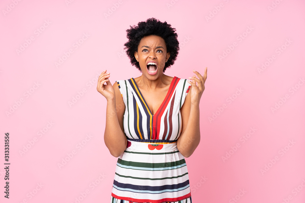 African american woman over isolated pink background frustrated by a bad situation
