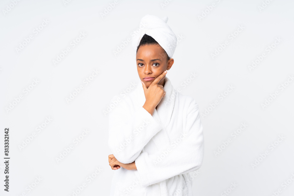 African american woman in a bathrobe over isolated background thinking an idea African american woman in a bathrobe over isolated background thinking an idea
