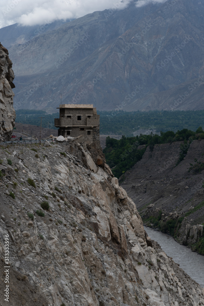 Fototapeta premium House buildon top of a Cliff, Karakoram Highway, taken in August 2019