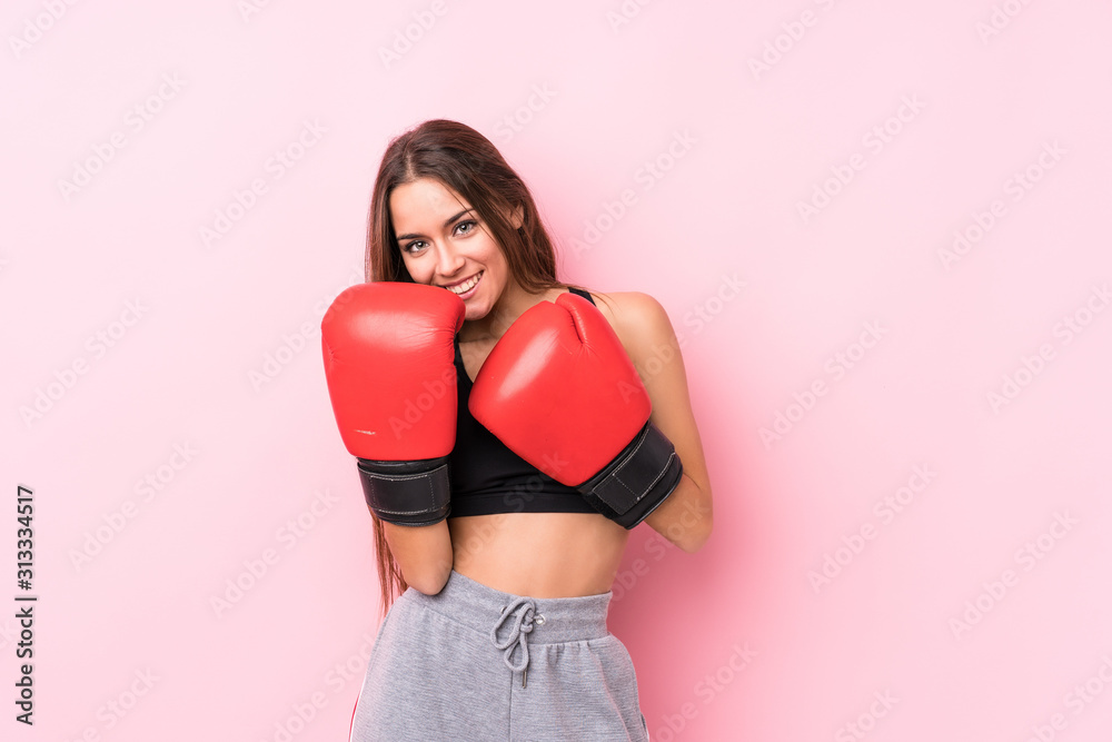 Young caucasian sporty woman boxing