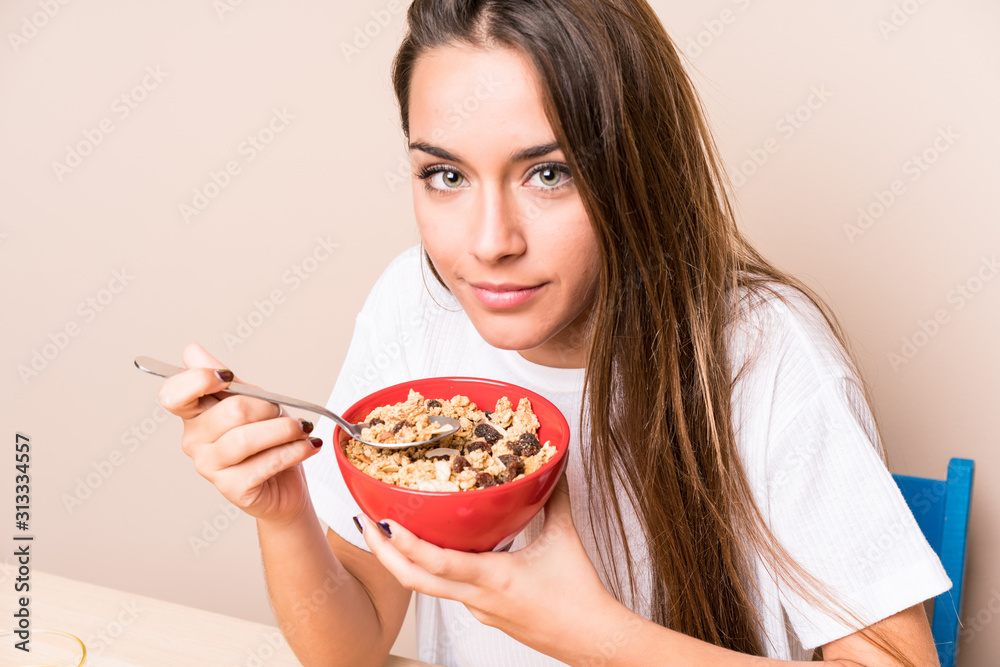 Young caucasian woman having breakfast