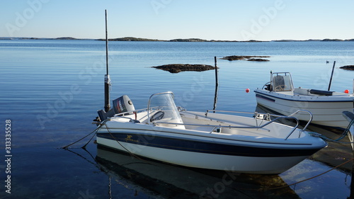 Little speedboats floating on blue water in Denmark