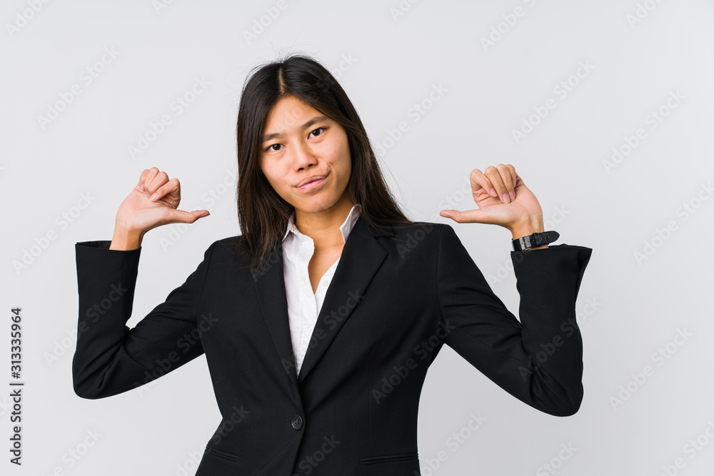 Young asian business woman feels proud and self confident, example to follow. Young asian business woman feels proud and self confident, example to follow.
