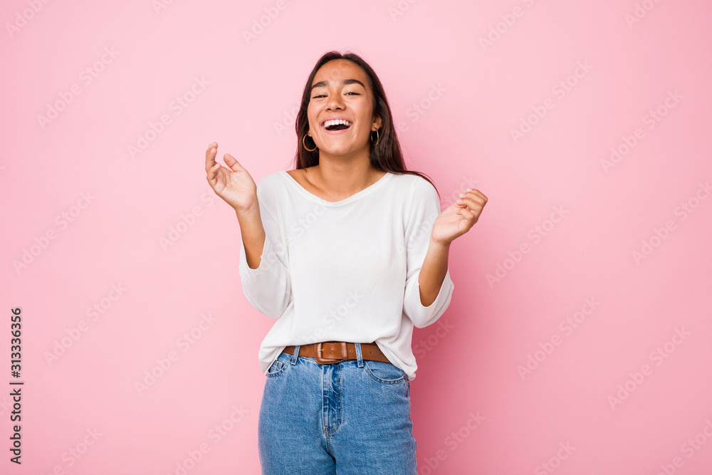 Young mixed race indian woman joyful laughing a lot. Happiness concept. Young mixed race indian woman joyful laughing a lot. Happiness concept.