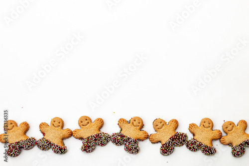 Symbol of Merry Christmas and Happy New Year: set of smiling gingerbread man. Sweet holiday cookies isolated on white background