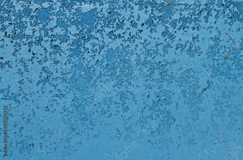 Blue peeling paint on a metal surface.