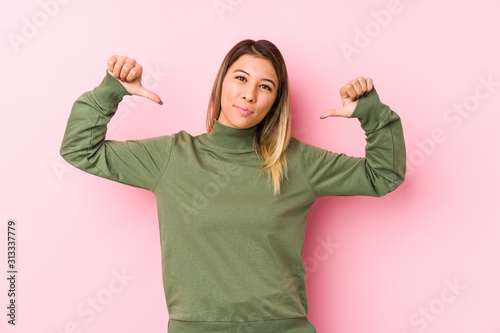 Young caucasian woman posing isolated  feels proud and self confident, example to follow.
