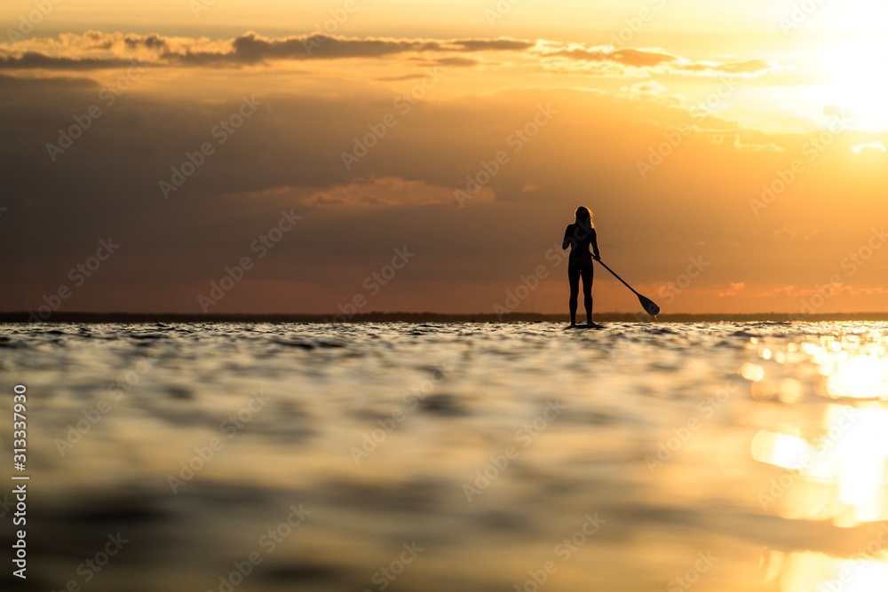 Sunset paddlesurfing. 
