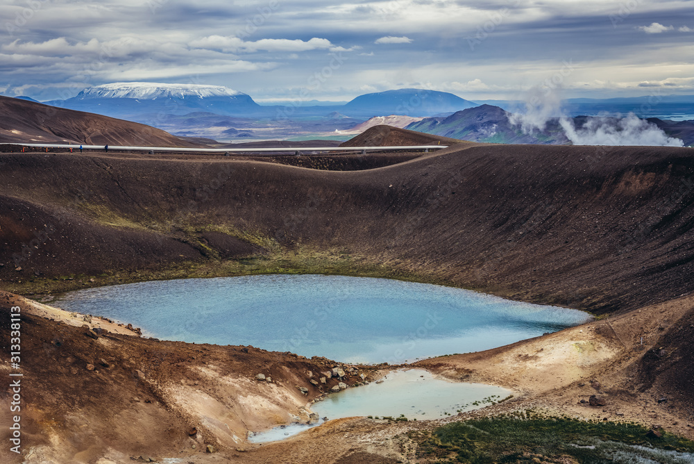 Small crater filled with water seen from Viti crater of Krafla volcanic caldera in Myvatn area, Iceland