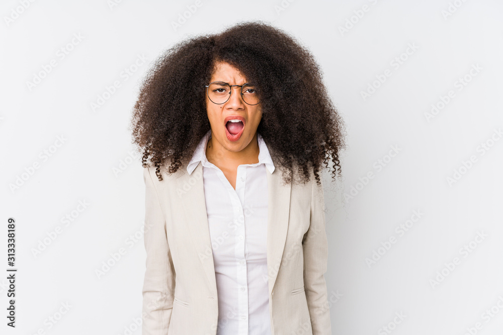 Fototapeta premium Young african american business woman screaming very angry and aggressive.