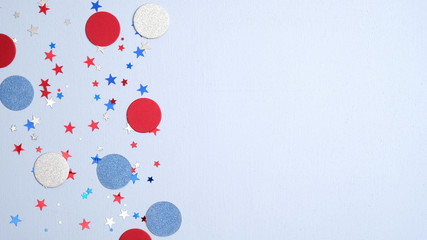 Presidents Day banner. USA Independence Day, US election concept. American national colors confetti stars and decorations on blue background. Flat lay, top view.