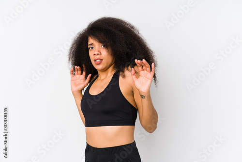 Young african american sporty woman being shocked due to an imminent danger