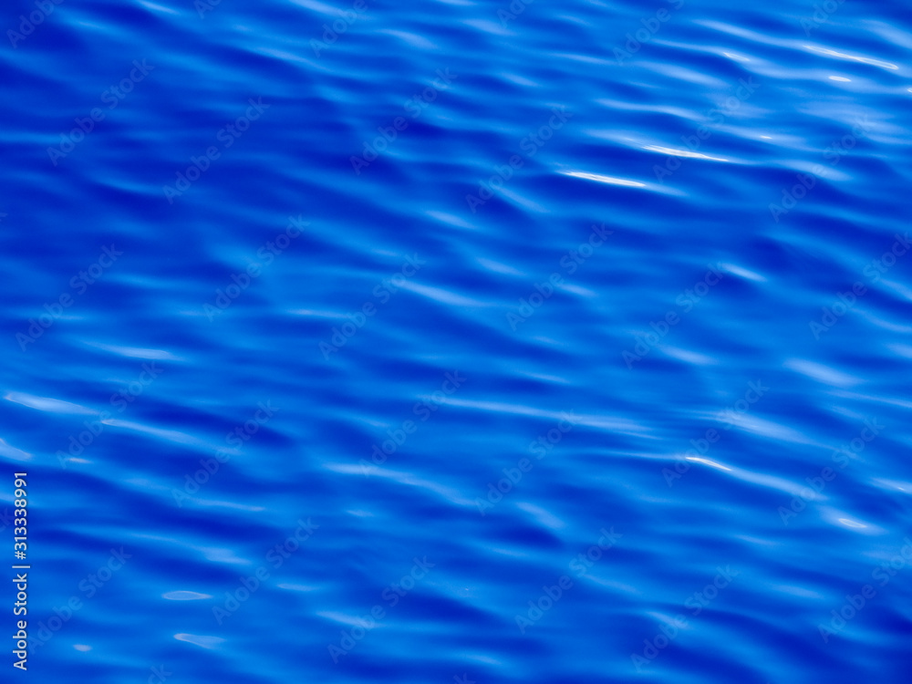 Background texture of vivid blue ocean water with ripples and waves. Background texture of vivid blue ocean water with ripples and waves.