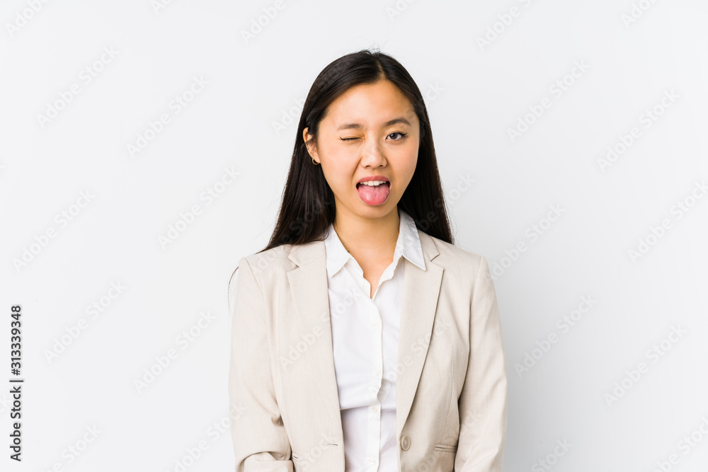 Young chinese business woman isolated funny and friendly sticking out tongue. Young chinese business woman isolated funny and friendly sticking out tongue.