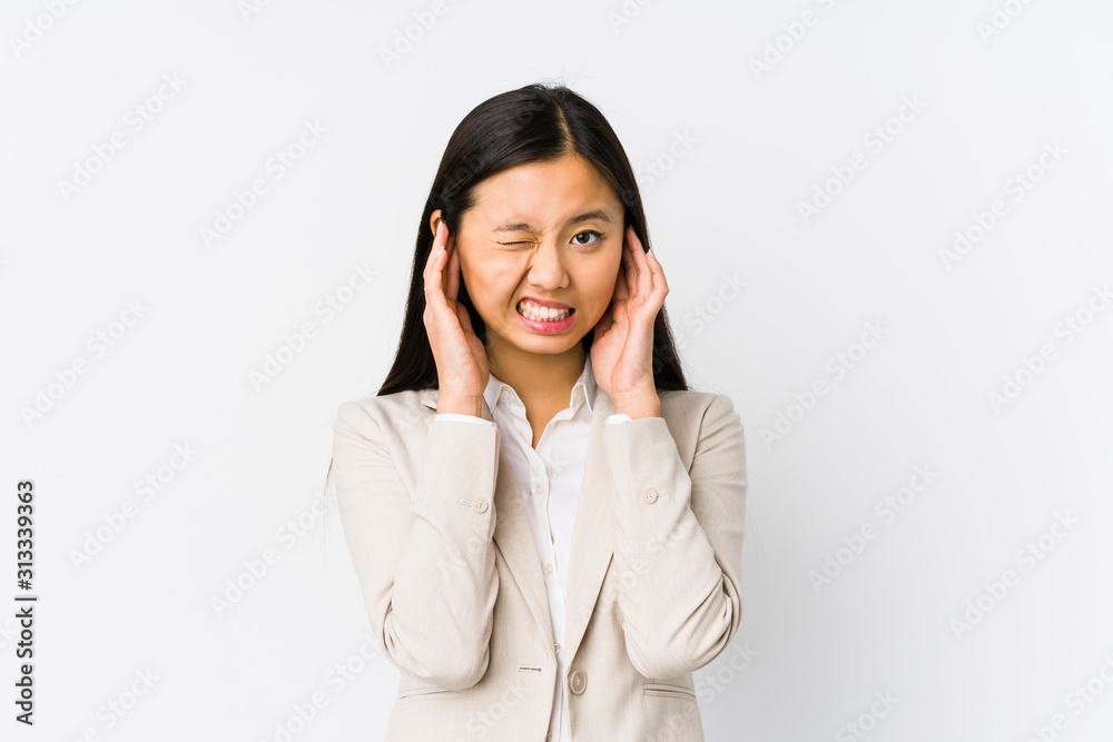 Young chinese business woman isolated covering ears with hands. Young chinese business woman isolated covering ears with hands.