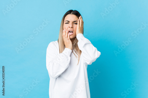 Young caucasian woman isolated whining and crying disconsolately.