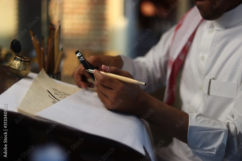 Skilled Arab Man doing Arabic Calligraphy Stock Photo | Adobe Stock