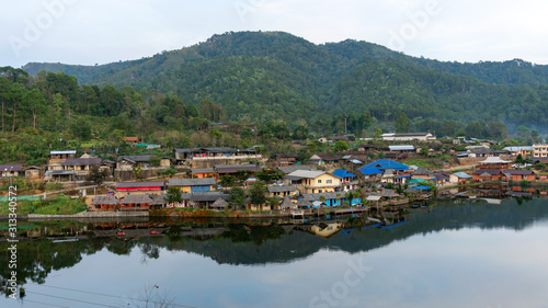 Landscape view with reflexion in the lake at Ban Rak thai village in Mae Hong Son Thailand. © panya99