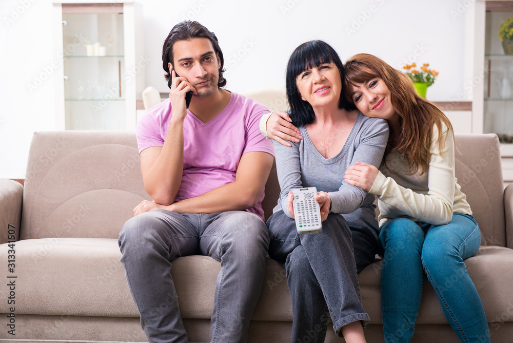 Young family and mother-in-law in family issues concept Young family and mother-in-law in family issues concept
