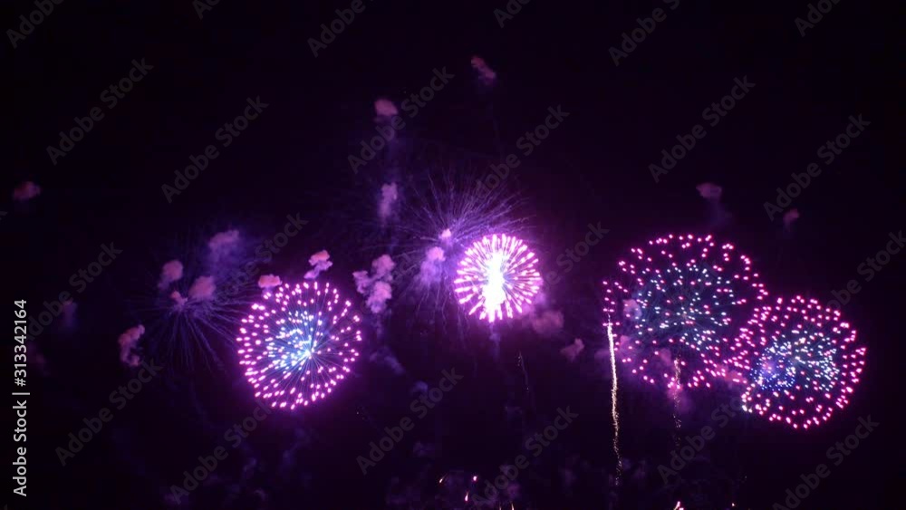 Beautiful abstract colourful Fireworks explode display on sky at night a symbol of celebration in New years anniversary for background